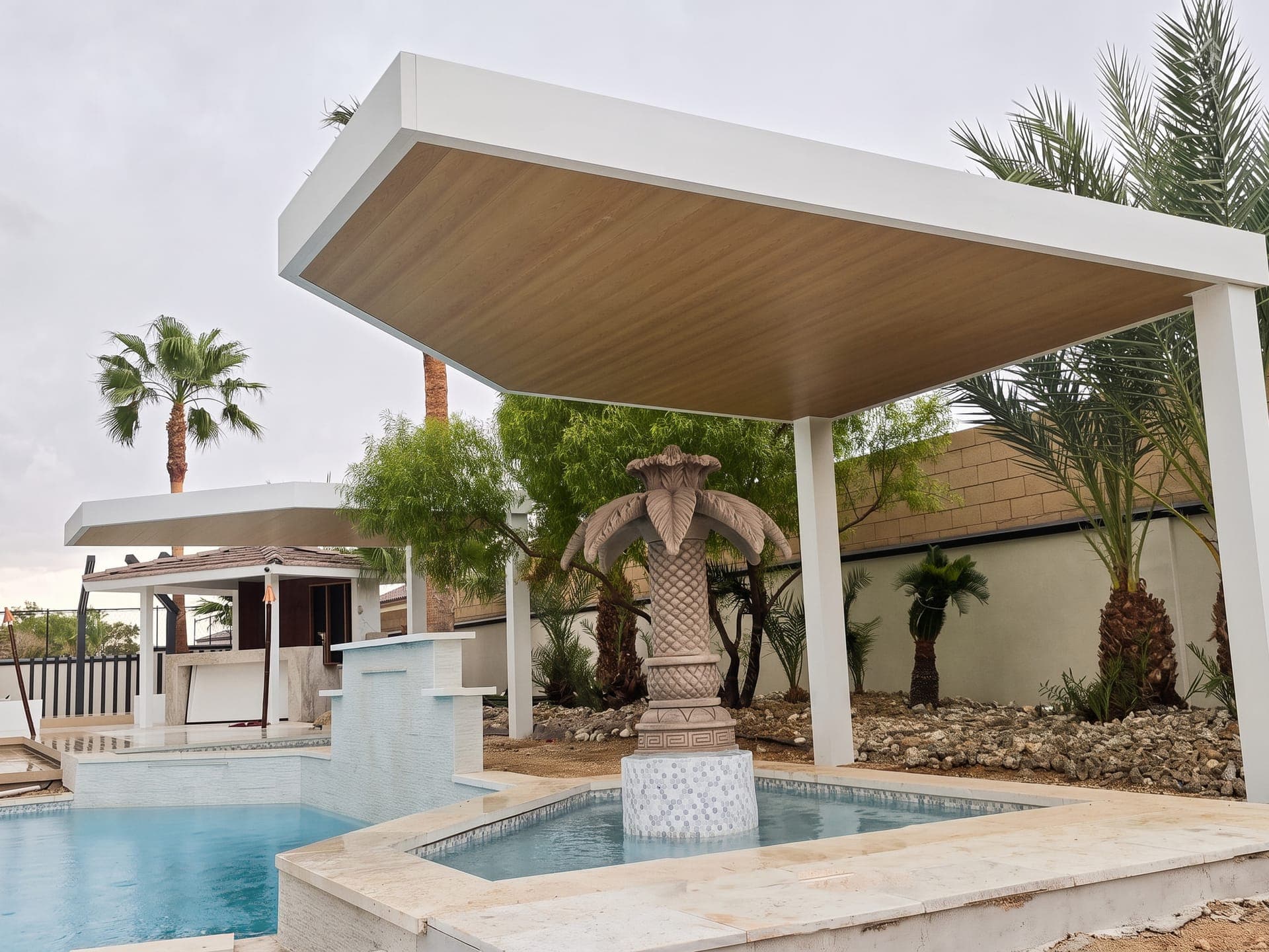 White 4K Aluminum cantilever cover with a solid roof and wood-look ceiling over a pool fountain and spa